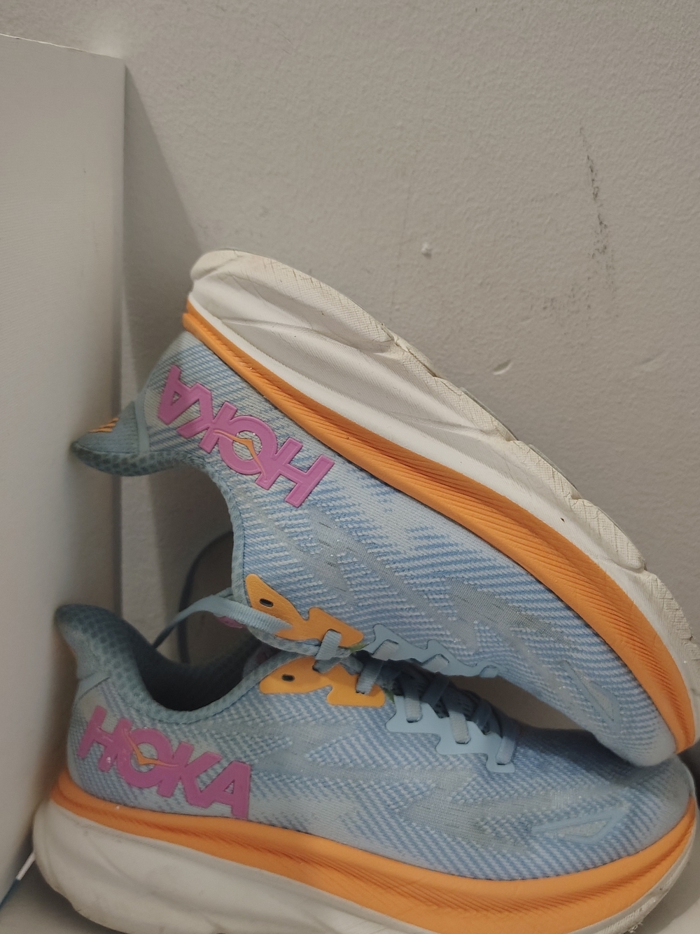 Hoka Kids Light Blue Sneakers with Orange Midsole and Pink Logo